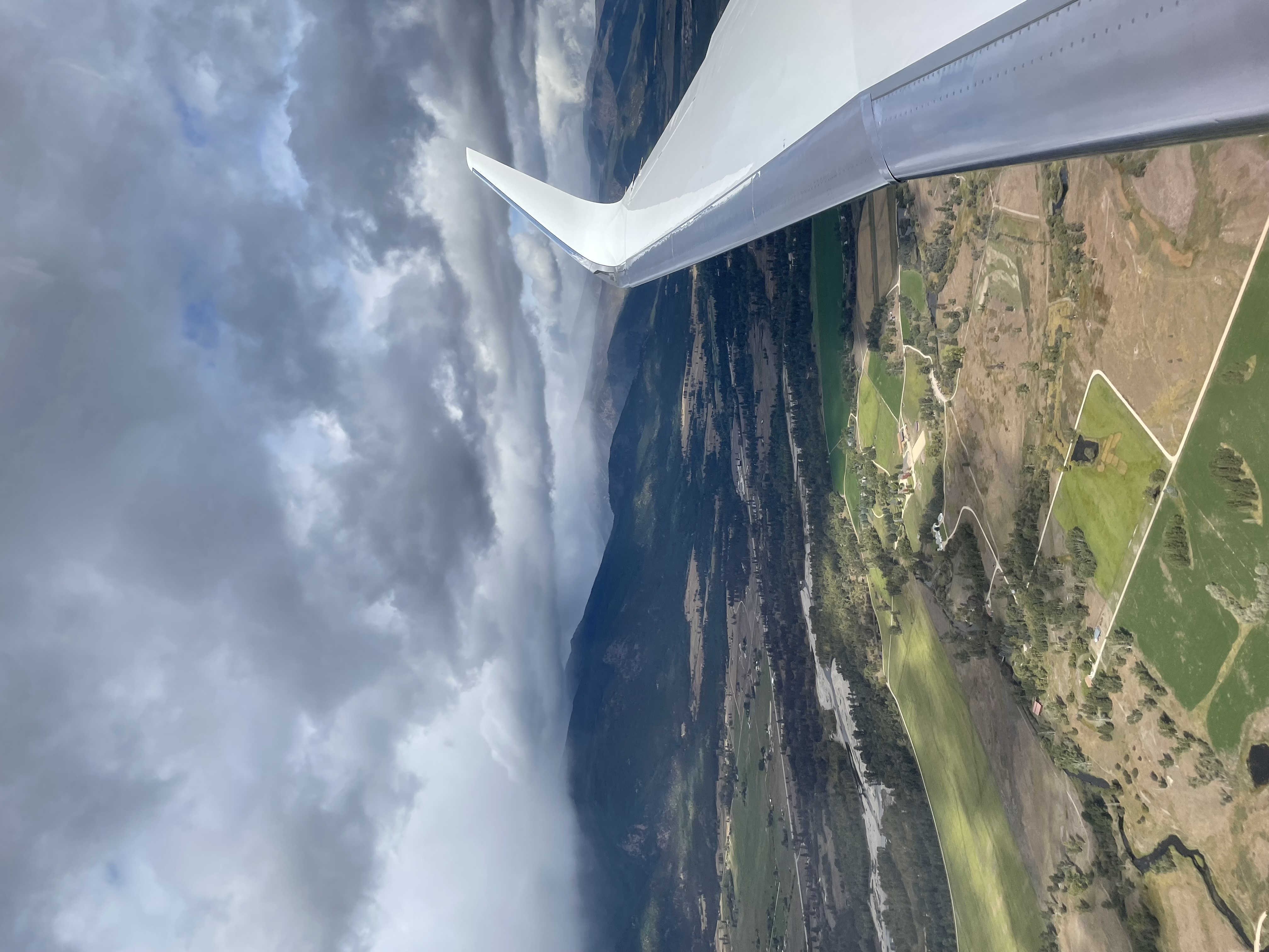 Wing view over mountains from the Gulfstream G550